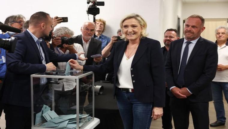 France’s far right leads in first round of elections, exit polls show