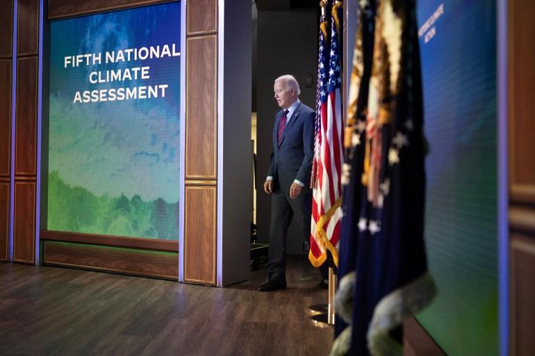 Biden walks to a podium before delivering remarks on the White House initiative on climate change in November 2023 [Tom Brenner/Reuters]
