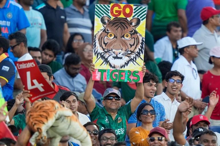 A Bangladesh fan holds a placard during the T20 World Cup match between Sri Lanka and Bangladesh at Grand Prairie Stadium in Texas, United States [LM Otero/AP]