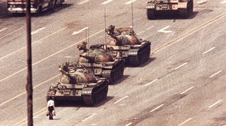 A man in front of a convoy of tanks in Tiananmen Square in Beijing, 1989.