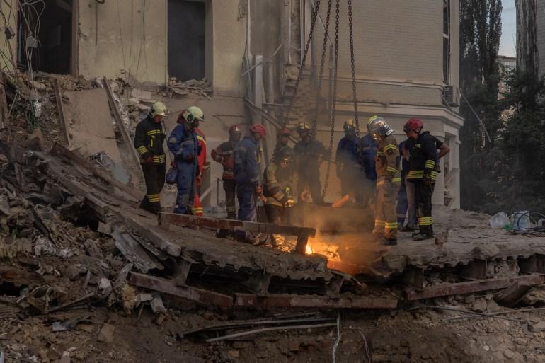 Emergency and rescue personnel operate and clear the rubble of the destroyed building of Okhmatdyt Children's Hospital following a missile strike in the Ukrainian capital of Kyiv on July 8, 2024, amid the Russian invasion of Ukraine. - Russia struck cities across Ukraine on July 8, 2024, with a missile barrage that killed three dozen people and ripped open a children's hospital in Kyiv, an assault condemned as a ruthless attack on civilians.