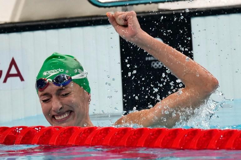 South Africa’s Tatjana Smith celebrates after winning the women’s 100m breaststroke final