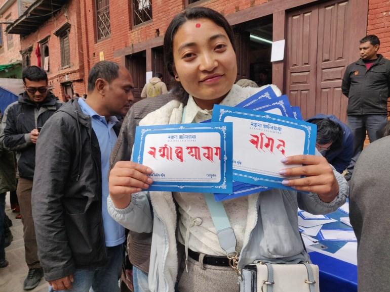 Rashmi Chhusyabaga, 22, who is a member of the Newar community, has the names of her family members written in Ranjana Lipi at the demonstration