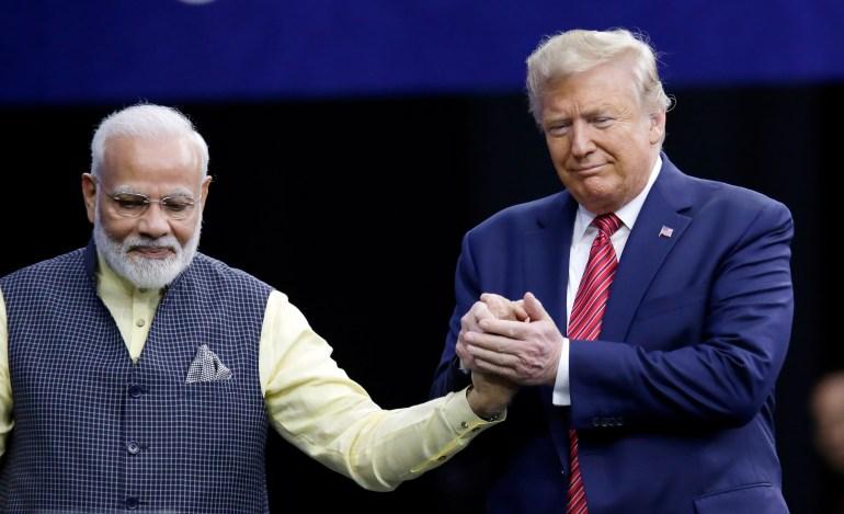 Prime Minister Narendra Modi and President Donald Trump shake hands after introductions during the ‘Howdi Modi’ event on Sunday, September 22, 2019, at the NRG Stadium in Houston [Michael Wyke/AP]